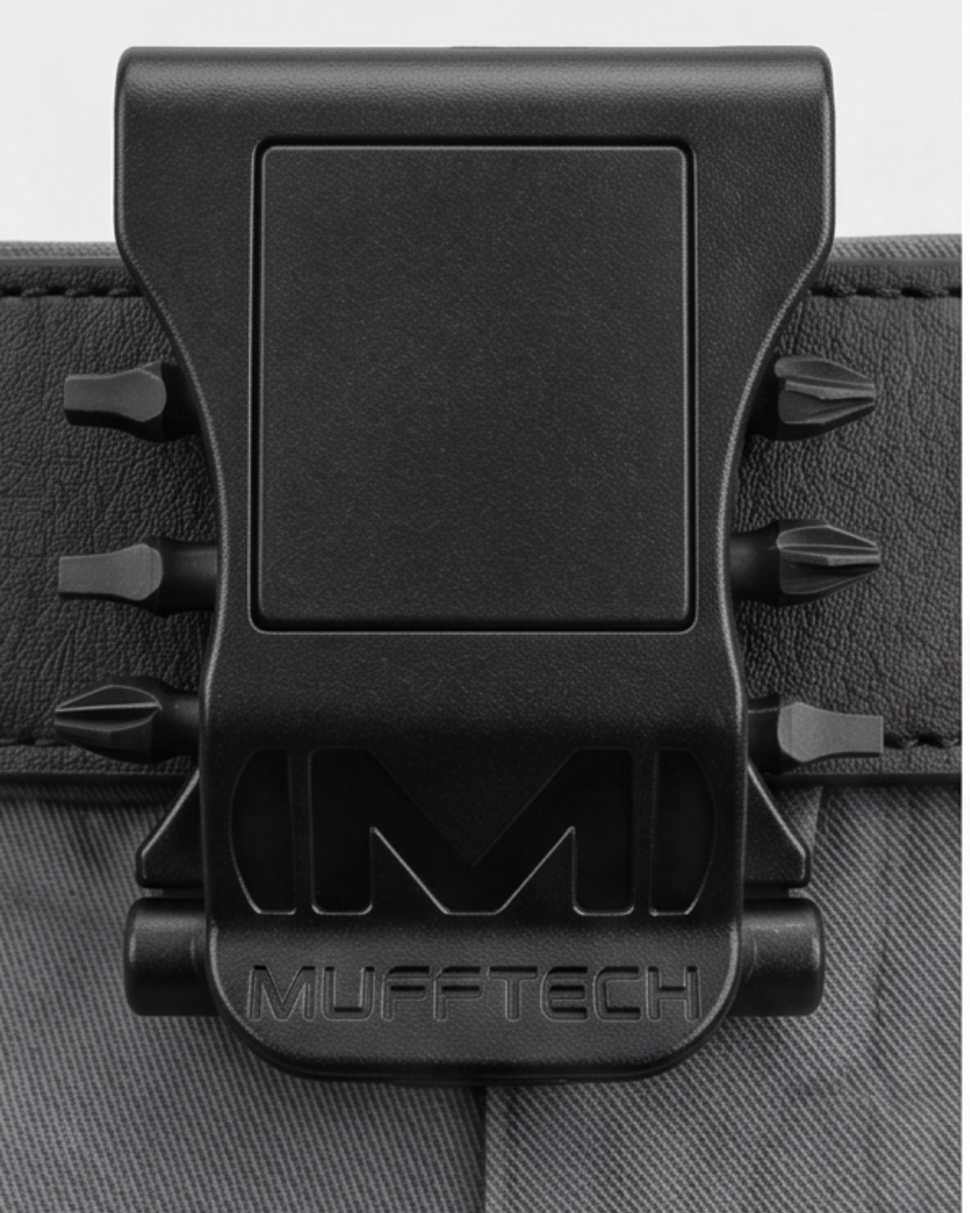 Black Mufftech product clip on a textured surface